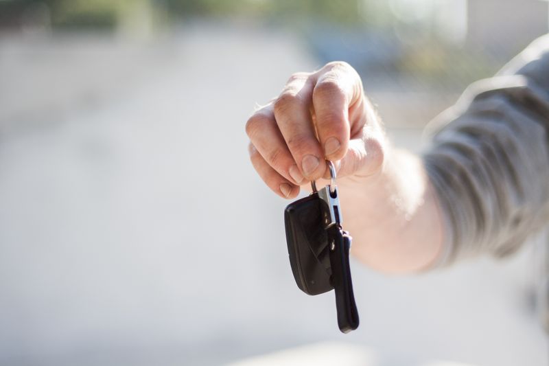 holding a car key